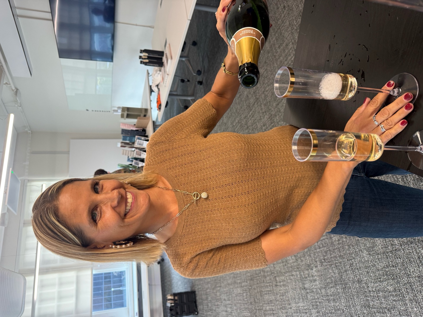 At a BBB gathering · A smiling guest pouring bubbly